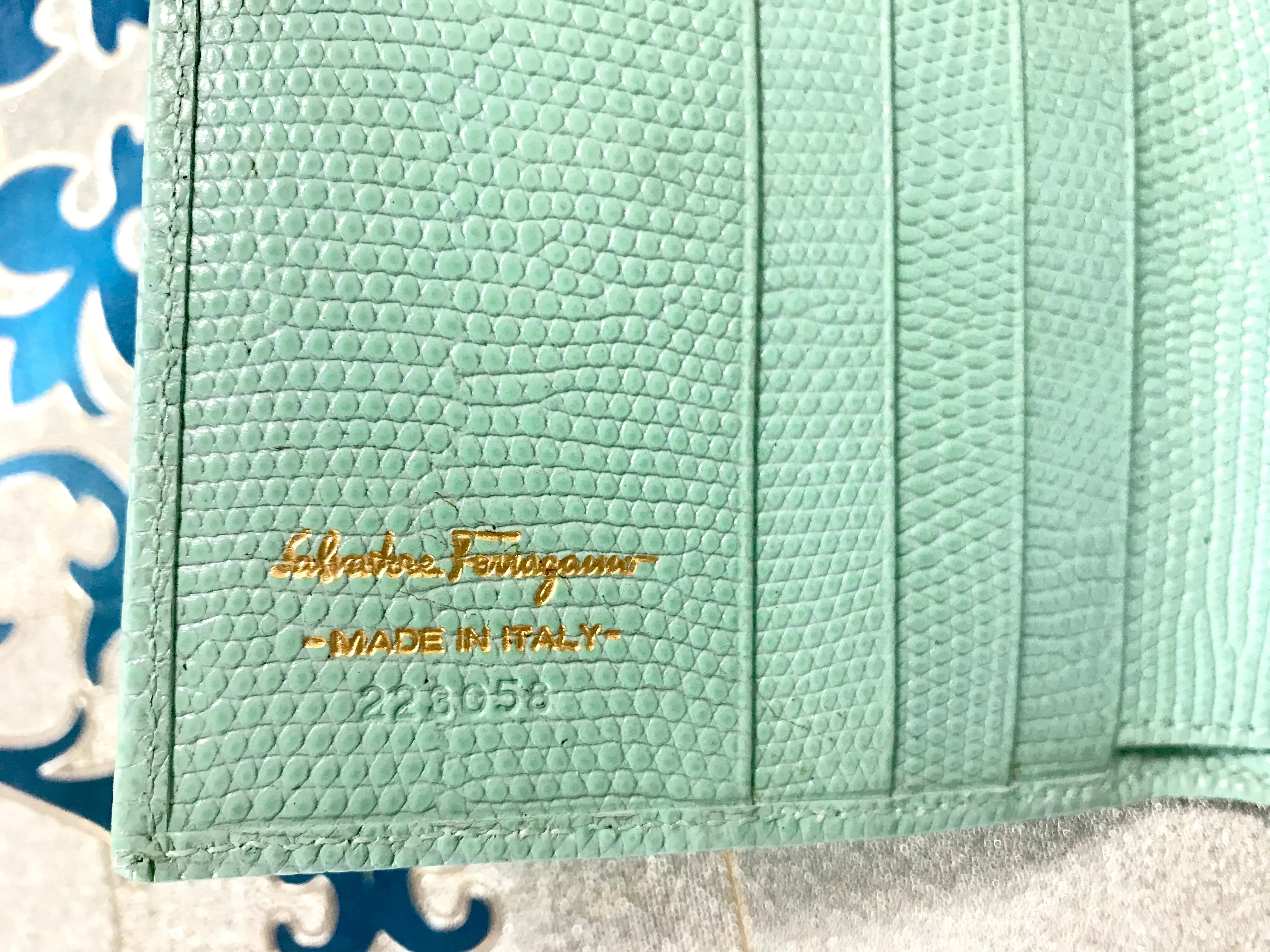 Vintage Salvatore Ferragamo blue lizard embossed leather wallet with gold tone vara motif. 05063012