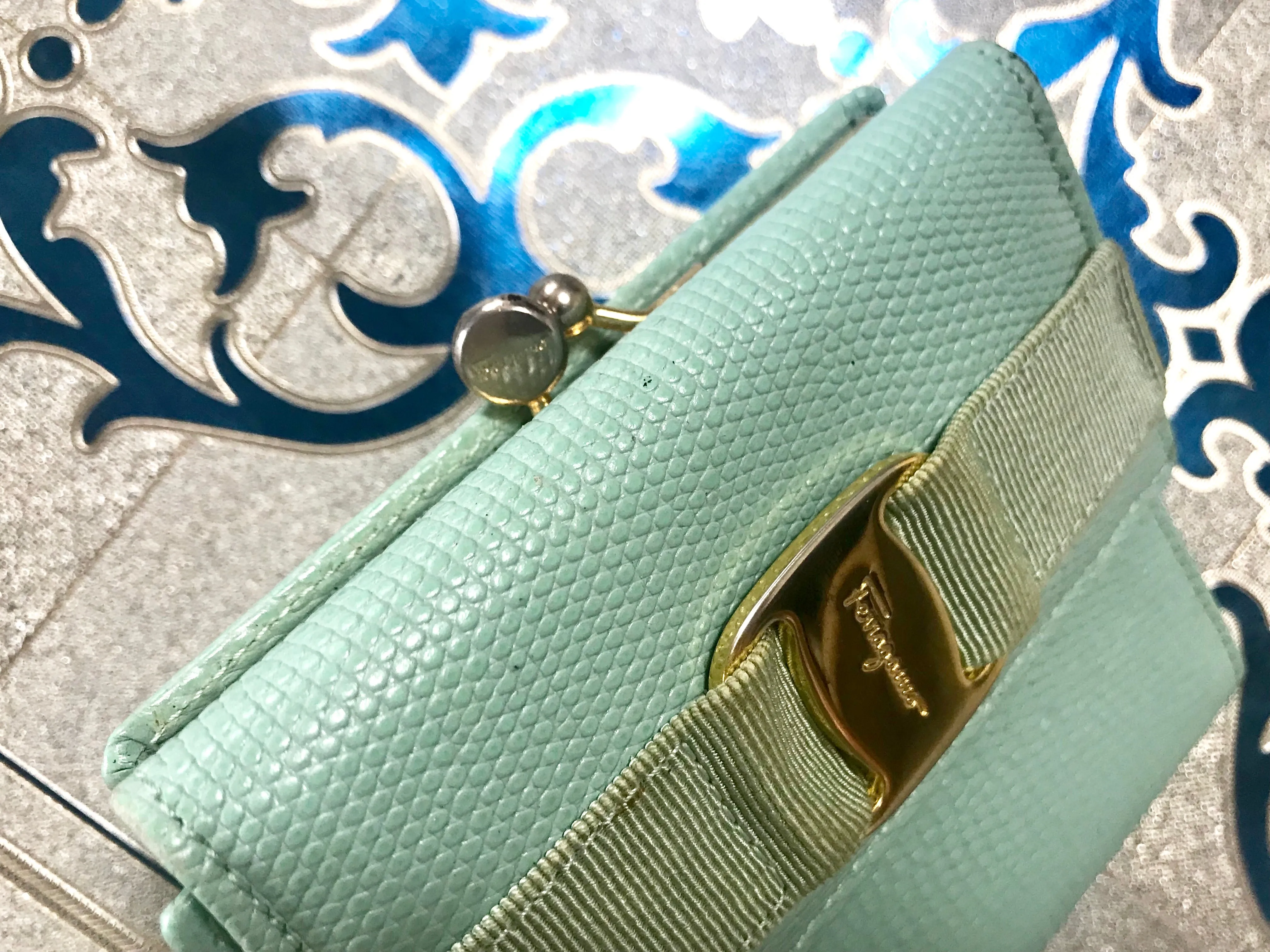 Vintage Salvatore Ferragamo blue lizard embossed leather wallet with gold tone vara motif. 05063012
