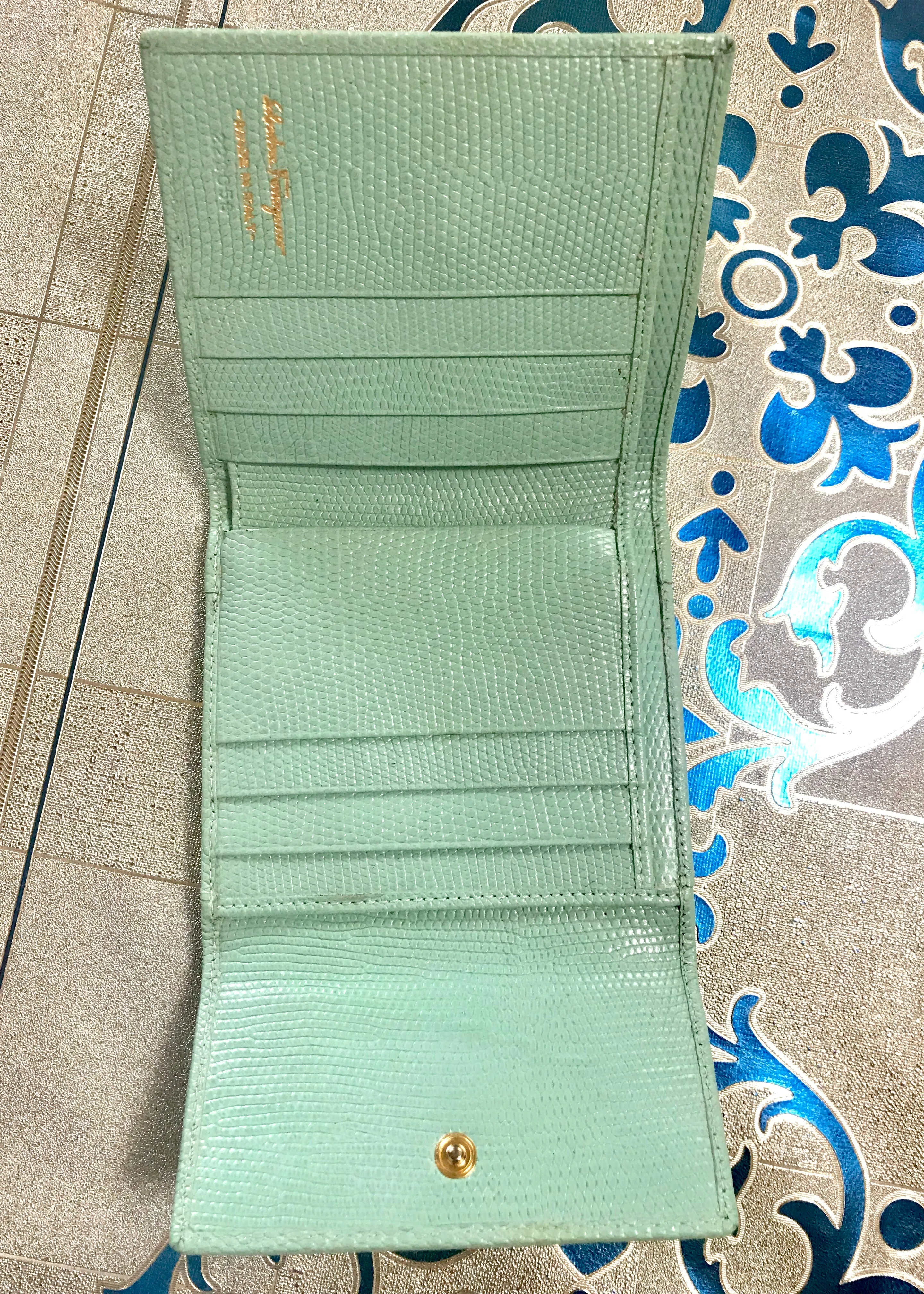 Vintage Salvatore Ferragamo blue lizard embossed leather wallet with gold tone vara motif. 05063012