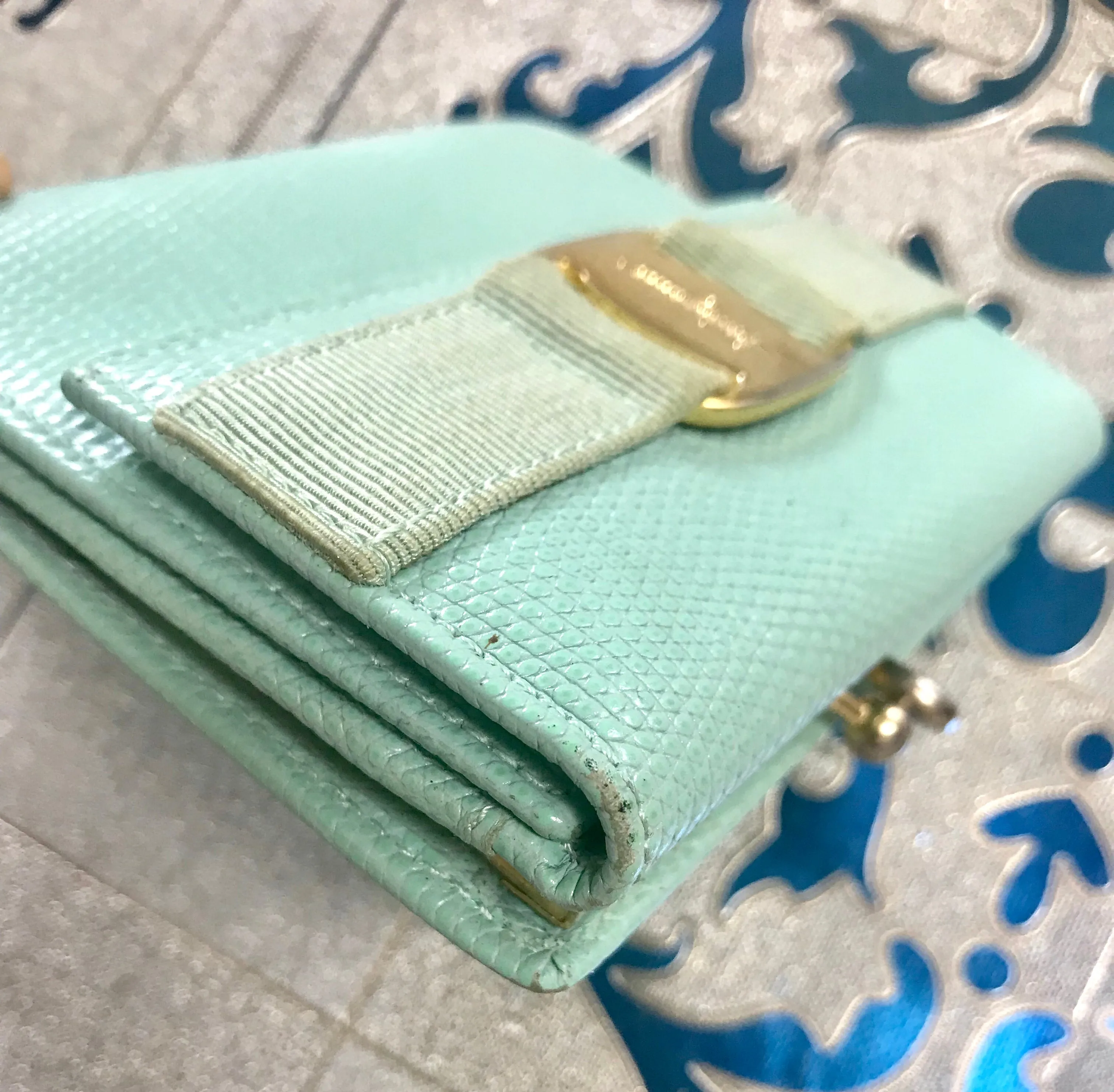 Vintage Salvatore Ferragamo blue lizard embossed leather wallet with gold tone vara motif. 05063012