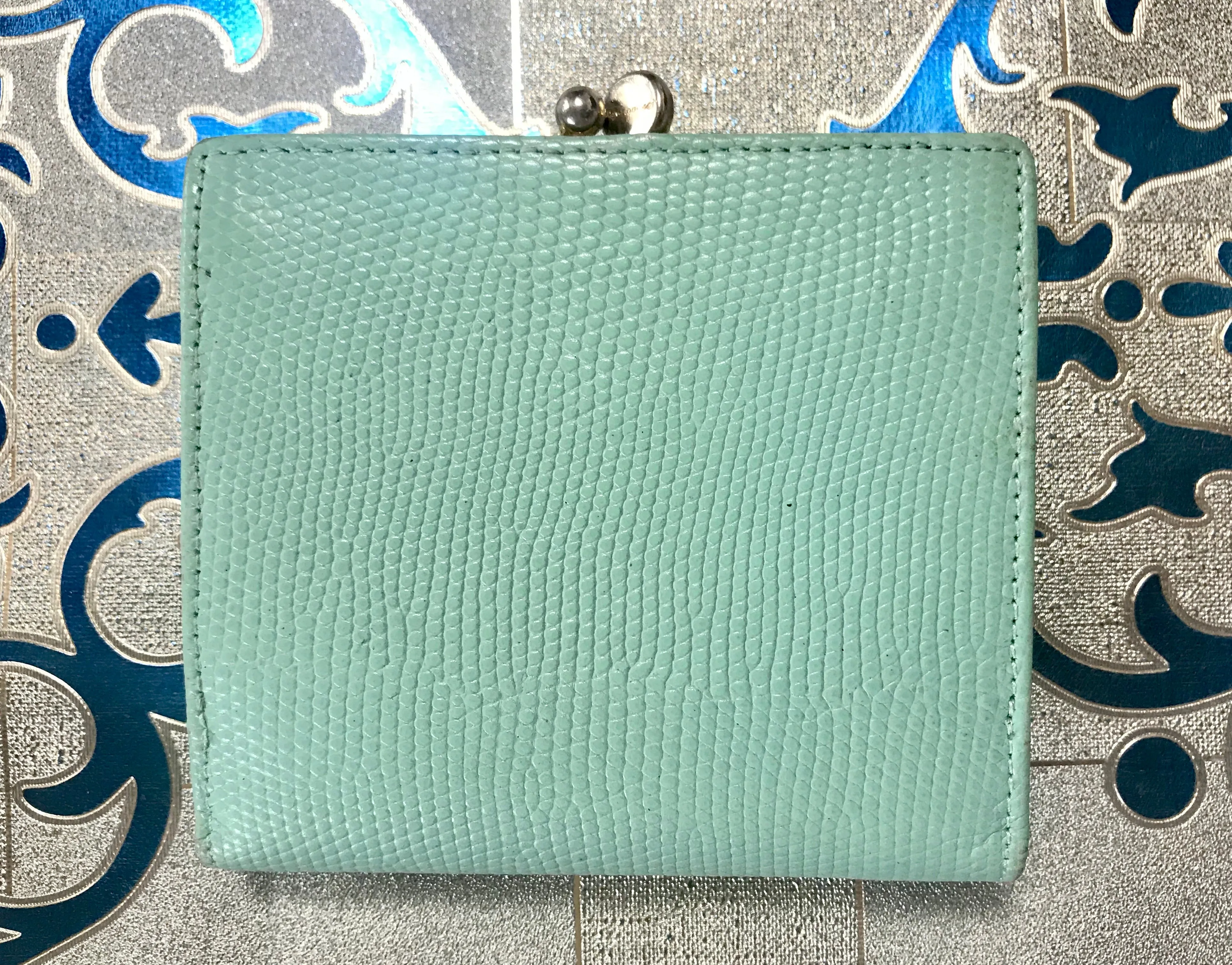 Vintage Salvatore Ferragamo blue lizard embossed leather wallet with gold tone vara motif. 05063012