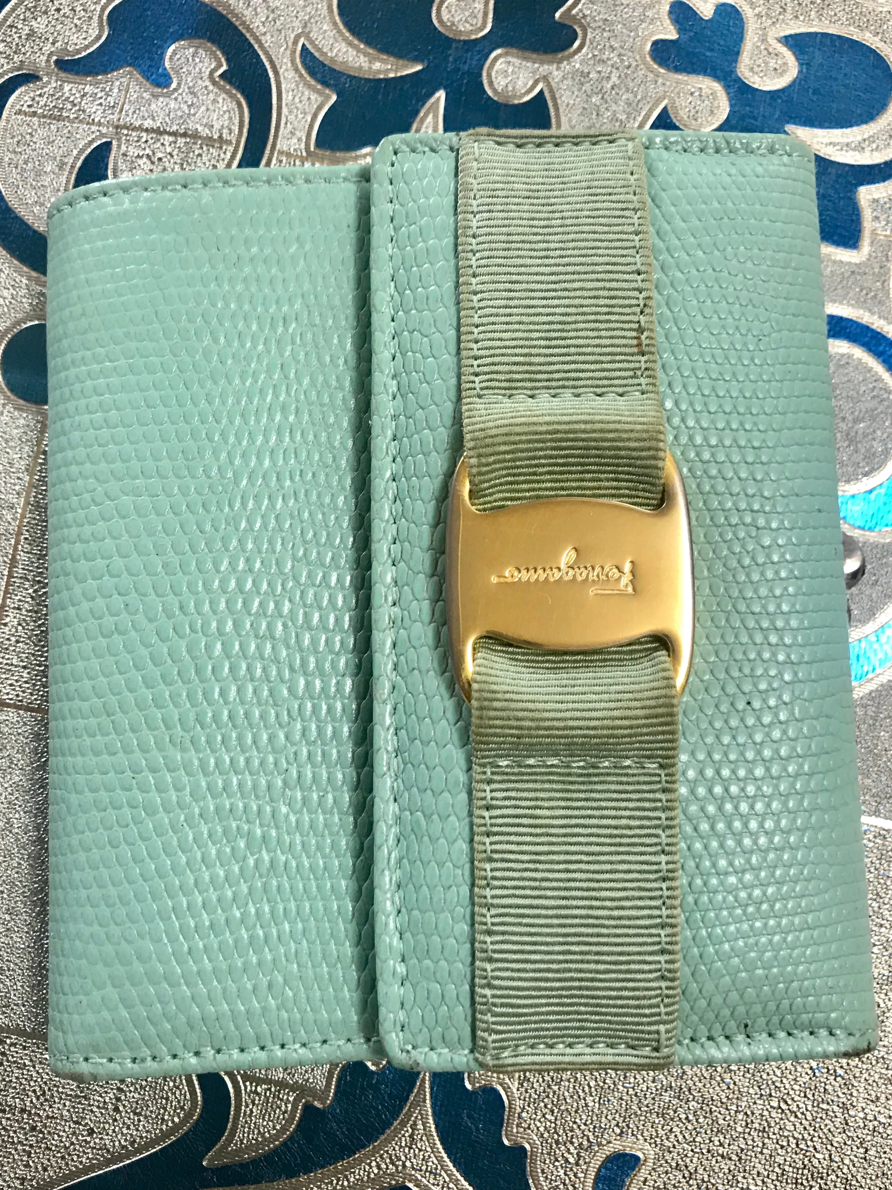 Vintage Salvatore Ferragamo blue lizard embossed leather wallet with gold tone vara motif. 05063012