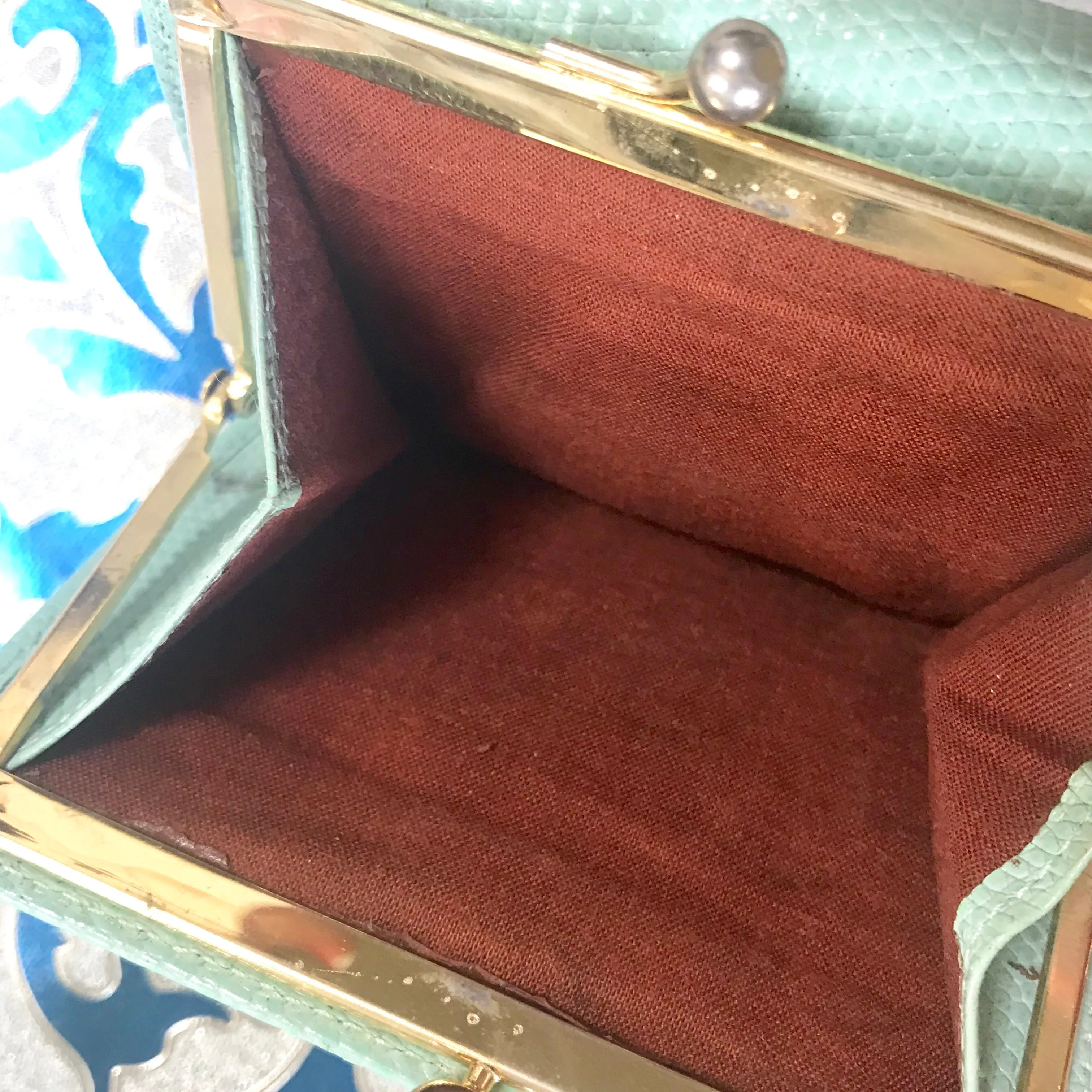 Vintage Salvatore Ferragamo blue lizard embossed leather wallet with gold tone vara motif. 05063012