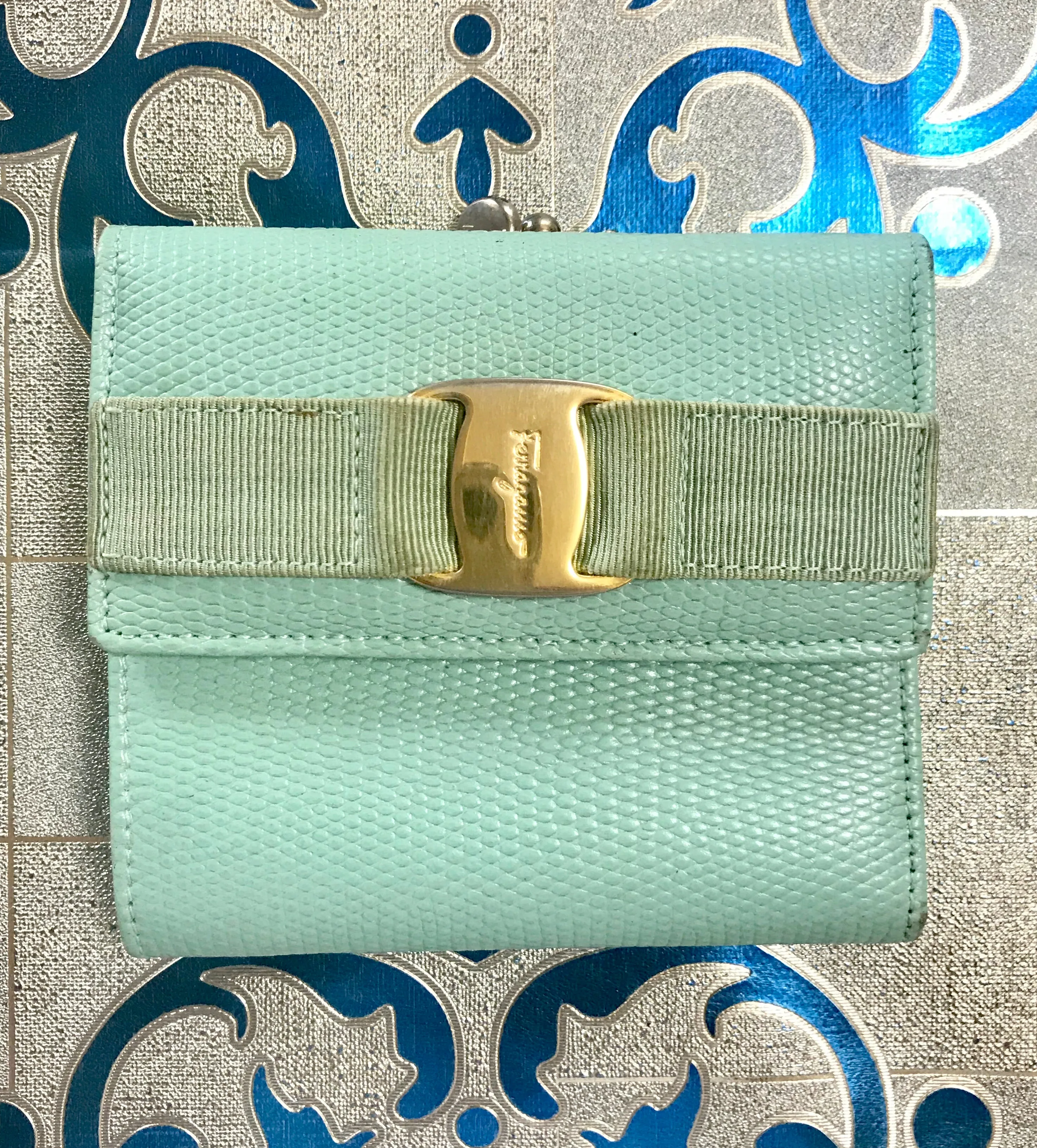 Vintage Salvatore Ferragamo blue lizard embossed leather wallet with gold tone vara motif. 05063012